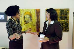 Barbieo Barros Gizzi shows her artwork to Mayor Kim Driscoll Copyright 2006 Jerry Halberstadt