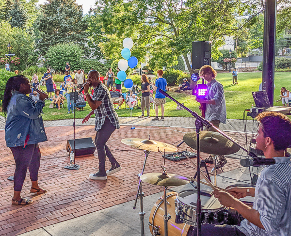 Singers and band perform