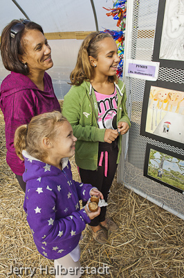 Plourde family looks at artwork